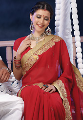 It is color this season and bright shaded suits are really something that is totally in vogue. This red chiffon saree is nicely designed with embroidered and patch border work is done with zari, stone and lace work. Saree gives you a singular and dissimilar look. Matching blouse is available. Slight color variations are possible due to differing screen and photograph resolution.
