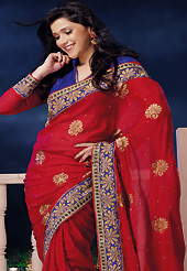 Style and trend will be at the peak of your beauty when you adorn this saree. This red chiffon saree is nicely designed with embroidered and patch border work is done with zari, stone and lace work. Saree gives you a singular and dissimilar look. Contrasting blue dupion and chiffon blouse is available. Slight color variations are possible due to differing screen and photograph resolution.
