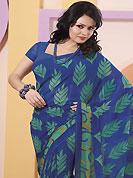 The most radiant carnival of style and beauty. This blue and sea green faux chiffon saree is nicely designed with abstract and leaf print work. Saree gives you a singular and dissimilar look. Matching blouse is available. Slight color variations are possible due to differing screen and photograph resolution.