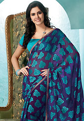 Try out this year top trend, glowing, bold and natural collection. This violet and turquoise faux georgette saree is nicely designed with abstract, paisley print and patch bordered work. Saree gives you a singular and dissimilar look. Matching turquoise blouse is available. Slight color variations are possible due to differing screen and photograph resolution.