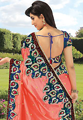 Be the cynosure of all eyes with this wonderful casual wear in flattering colors and combinations. This dark peach saree is nicely designed with embroidered and velvet patch work is done with resham, zari, stone and lace work. Saree gives you a singular and dissimilar look. Contrasting blue blouse is available. Slight color variations are possible due to differing screen and photograph resolution.