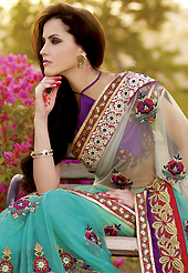 Exquisite combination of color, fabric can be seen here. This off white and aqua blue net saree is nicely designed with heavy embroidered patch work is done with resham, zari, beads, stone and kasab work. Beautiful embroidery patch border on saree make attractive to impress all. This saree gives you a modern and different look in fabulous style. Contrasting purple blouse is available with this saree. Slight color variations are possible due to differing screen and photograph resolution.