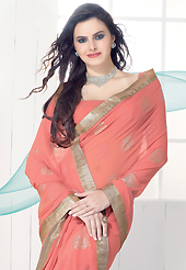 Outfit is a novel ways of getting yourself noticed. This dark peach faux georgette saree is nicely designed with self weaving zari and patch bordered work. This saree gives you a modern and different look in fabulous style. Matching blouse is available. Slight color variations are possible due to differing screen and photograph resolution.