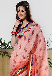 Style and trend will be at the peak of your beauty when you adorn this saree. This shaded peach art silk saree have beautiful floral, abstract print and embroidery work which is embellished with resham, zari and patch border work. Fabulous designed embroidery gives you an ethnic look and increasing your beauty. Matching blouse is available. Slight Color variations are possible due to differing screen and photograph resolutions.