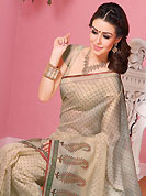 Keep the interest with this designer printed saree. This beautiful beige cotton saree is nicely designed with floral, paisley, stripe print and self weaving zari work. Beautiful print work on saree make attractive to impress all. It will enhance your personality and gives you a singular look. Matching blouse is available with this saree. Slight color variations are due to differing screen and photography resolution.