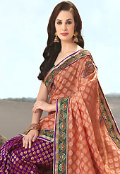 The glamorous silhouette to meet your most dire fashion needs. This dark peach and purple banarasi art silk and uppada silk saree have beautiful embroidery patch work which is embellished with resham, zari, stone and beads work. Fabulous designed embroidery gives you an ethnic look and increasing your beauty. Matching blouse is available. Slight Color variations are possible due to differing screen and photograph resolutions.