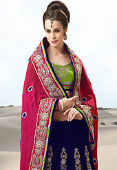 The glamorous silhouette to meet your most dire fashion needs. This dark pink and navy blue faux crepe and velvet lehenga style saree have beautiful embroidery patch work which is embellished with resham, zari, stone and beads work. Fabulous designed embroidery gives you an ethnic look and increasing your beauty. Contrasting light green blouse is available. Slight Color variations are possible due to differing screen and photograph resolutions.