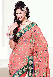 Dreamy variation on shape and forms compliment your style with tradition. This dark peach faux georgette saree is nicely designed with embroidered patch work is done with resham, zari and stone work. Beautiful embroidery work on saree make attractive to impress all. This saree gives you a modern and different look in fabulous style. Matching blouse is available. Slight color variations are possible due to differing screen and photograph resolution.