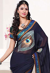 The glamorous silhouette to meet your most dire fashion needs. This navy blue and dark green faux georgette saree is nicely designed with embroidered patch work is done with resham, zari and sequins work. Beautiful embroidery work on saree make attractive to impress all. This saree gives you a modern and different look in fabulous style. Matching blouse is available. Slight color variations are possible due to differing screen and photograph resolution.