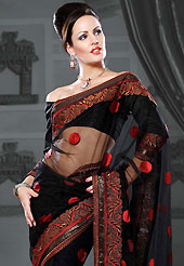 Look stunning rich with dark shades and floral patterns This black net saree is nicely designed with embroidered patch work is done with resham and zari work. Beautiful embroidery work on saree make attractive to impress all. This saree gives you a modern and different look in fabulous style. Matching blouse is available. Slight color variations are possible due to differing screen and photograph resolution.