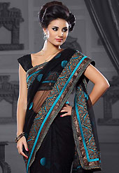 The evolution of style species collection spells pure femininity. This black net saree is nicely designed with embroidered patch work is done with resham and zari work. Beautiful embroidery work on saree make attractive to impress all. This saree gives you a modern and different look in fabulous style. Matching blouse is available. Slight color variations are possible due to differing screen and photograph resolution.