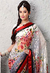 Dreamy variation on shape and forms compliment your style with tradition. This off white and shaded grey brasso faux georgette saree is nicely designed with floral print and sequins work. Beautiful embroidery work on saree make attractive to impress all. This saree gives you a modern and different look in fabulous style. Matching blouse is available. Slight color variations are possible due to differing screen and photograph resolution.