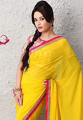 Elegance and innovation of designs crafted for you. This yellow faux chiffon saree is nicely designed with zari and sequins work. Beautiful embroidery work on saree make attractive to impress all. This saree gives you a modern and different look in fabulous style. Contrasting pink blouse is available. Slight color variations are possible due to differing screen and photograph resolution.