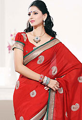 Make a trendy look with this classic embroidered saree. This red art silk saree is nicely designed with embroidered patch work is done with resham, zari and sequins work. Beautiful embroidery work on saree make attractive to impress all. This saree gives you a modern and different look in fabulous style. Matching blouse is available. Slight color variations are possible due to differing screen and photograph resolution.