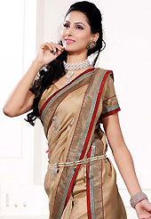 Style and trend will be at the peak of your beauty when you adorn this saree. This fawn art silk saree is nicely designed with embroidered patch work is done with resham, zari and sequins work. Beautiful embroidery work on saree make attractive to impress all. This saree gives you a modern and different look in fabulous style. Matching blouse is available. Slight color variations are possible due to differing screen and photograph resolution.