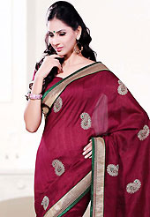 It is color this season and bright shaded suits are really something that is totally in vogue. This deep pink art silk saree is nicely designed with embroidered patch work is done with resham, zari and sequins work. Beautiful embroidery work on saree make attractive to impress all. This saree gives you a modern and different look in fabulous style. Matching blouse is available. Slight color variations are possible due to differing screen and photograph resolution.