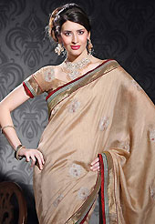 The traditional patterns used on this saree maintain the ethnic look. This fawn art silk saree is nicely designed with embroidered patch work is done with resham, zari and sequins work. Beautiful embroidery work on saree make attractive to impress all. This saree gives you a modern and different look in fabulous style. Matching blouse is available. Slight color variations are possible due to differing screen and photograph resolution.