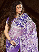 Make a trendy look with this classic embroidered saree. This purple net saree have beautiful embroidery patch work which is embellished with resham, zari and sequins work. Fabulous designed embroidery gives you an ethnic look and increasing your beauty. Matching blouse is available. Slight Color variations are possible due to differing screen and photograph resolutions.