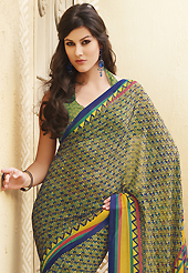 Attract all attentions with this printed saree. This olive green, yellow and blue faux georgette saree is nicely designed with abstract and geometric print work. Saree gives you a singular and dissimilar look. Matching blouse is available. Slight color variations are possible due to differing screen and photograph resolution.
