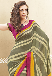 Keep the interest with this printed saree. This dark olive green and cream faux georgette saree is nicely designed with geometric print work. Saree gives you a singular and dissimilar look. Contrasting dark pink blouse is available. Slight color variations are possible due to differing screen and photograph resolution.