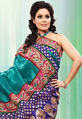 Exquisite combination of color, fabric can be seen here. This teal green bhagalpuri jacquard silk saree is nicely designed with embroidered patch work is done with resham, zari and stone work. Saree gives you a singular and dissimilar look. Matching blouse is available. Slight color variations are possible due to differing screen and photograph resolution.