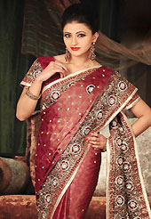 Embroidered sarees are the best choice for a girl to enhance her feminine look. This brown and red tissue brocade saree have beautiful embroidery patch work which is embellished with resham, stone and cutbeads work. Fabulous designed embroidery gives you an ethnic look and increasing your beauty. Matching blouse is available. This saree is also available in A Yellow, B Green colors. Slight Color variations are possible due to differing screen and photograph resolutions.