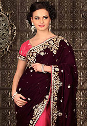 Make a trendy look with this classic embroidered saree. This deep burgundy and pink velvet and net saree have beautiful embroidery patch work which is embellished with stone and cutbeads work. Fabulous designed embroidery gives you an ethnic look and increasing your beauty. Matching blouse is available. Slight Color variations are possible due to differing screen and photograph resolutions.
