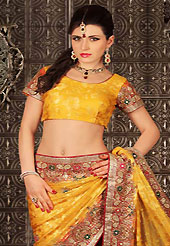 Style and trend will be at the peak of your beauty when you adorn this saree. This dark yellow brasso saree have beautiful embroidery patch work which is embellished with stone and cutbeads work. Fabulous designed embroidery gives you an ethnic look and increasing your beauty. Matching blouse is available. Slight Color variations are possible due to differing screen and photograph resolutions.