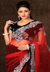 Make a trendy look with this classic embroidered saree. This red and black net and velvet saree have beautiful embroidery patch work which is embellished with stone and cutbeads work. Fabulous designed embroidery gives you an ethnic look and increasing your beauty. Matching black velvet blouse is available. Slight Color variations are possible due to differing screen and photograph resolutions.