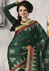 The most radiant carnival of style and beauty. This beautiful dark teal green art silk saree is nicely designed with floral and geometric print work. Beautiful print work on saree make attractive to impress all. It will enhance your personality and gives you a singular look. Matching blouse is available with this saree. Slight color variations are due to differing screen and photography resolution.
