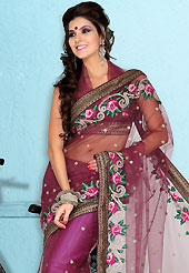 Ultimate collection of embroidered sarees with fabulous style. This burgundy net saree is nicely designed with embroidered patch work is done with resham, zari, sequins and stones work. Beautiful embroidery work on saree make attractive to impress all. This saree gives you a modern and different look in fabulous style. Matching blouse is available. Slight color variations are possible due to differing screen and photograph resolution.