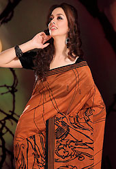 The most beautiful refinements for style and tradition. This beautiful rust and black art silk saree is nicely designed with abstract and geometric print work. Beautiful print work on saree make attractive to impress all. It will enhance your personality and gives you a singular look. Matching black blouse is available with this saree. Slight color variations are due to differing screen and photography resolution.