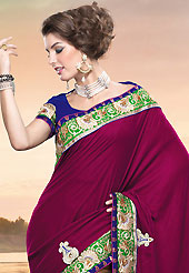 Outfit is a novel ways of getting yourself noticed. This burgundy and dark fawn crepe and shimmer saree is nicely designed with embroidered patch work is done with resham, zari, sequins and stone work. Beautiful embroidery work on saree make attractive to impress all. This saree gives you a modern and different look in fabulous style. Contrasting dark blue blouse is available. Slight color variations are possible due to differing screen and photograph resolution.