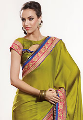 An casual wear perfect is ready to rock you. This olive green chiffon jacquard saree is nicely designed with embroidered patch work is done with zari work. Saree gives you a singular and dissimilar look. Matching blouse is available. Slight color variations are possible due to differing screen and photograph resolution.