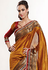 It is color this season and bright shaded suits are really something that is totally in vogue. This rust saree is nicely designed with embroidered patch work is done with self weaving zari, sequins and lace work. Saree gives you a singular and dissimilar look. Contrasting red blouse is available. Slight color variations are possible due to differing screen and photograph resolution.