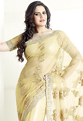 Elegance and innovation of designs crafted for you. This beige net saree is nicely designed with embroidered patch work is done with resham, zari and sequins work. Saree gives you a singular and dissimilar look. Matching blouse is available. Slight color variations are possible due to differing screen and photograph resolution.