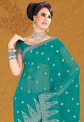 The most radiant carnival of style and beauty. This beautiful aqua blue faux chiffon saree is nicely designed with zari, stone and lace work. Beautiful print work on saree make attractive to impress all. Matching blouse is available with this saree. Slight color variations are due to differing screen and photography resolution.