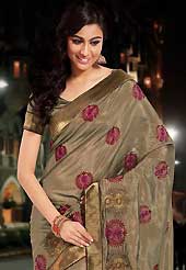 The traditional patterns used on this saree maintain the ethnic look. This dusty olive green bhagalpuri silk saree is nicely designed with embroidered patch work is done with resham and zari work. Saree gives you a singular and dissimilar look. Matching blouse is available. Slight color variations are possible due to differing screen and photograph resolution.
