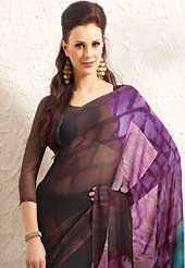 Envelope yourself in classic look with this charming saree. This beautiful deep brown, purple and blue faux georgette saree is nicely designed with abstract print. Beautiful print work on saree make attractive to impress all. It will enhance your personality and gives you a singular look. Matching blouse is available with this saree. Slight color variations are due to differing screen and photography resolution.