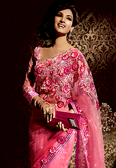 An occasion wear perfect is ready to rock you. This dark pink net saree is nicely designed with embroidered patch work is done with resham, stone and lace work. Beautiful embroidery work on saree make attractive to impress all. This saree gives you a modern and different look in fabulous style. Matching blouse is available. Slight color variations are possible due to differing screen and photograph resolution.