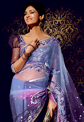 Different colors are a perfect blend of traditional Indian heritage and contemporary artwork. This light blue and dark purple net saree is nicely designed with embroidered patch work is done with resham, stone and lace work. Beautiful embroidery work on saree make attractive to impress all. This saree gives you a modern and different look in fabulous style. Matching blouse is available. Slight color variations are possible due to differing screen and photograph resolution.