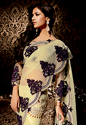 The most beautiful refinements for style and tradition. This beige net saree is nicely designed with embroidered patch work is done with resham, zari, stone and lace work. Beautiful embroidery work on saree make attractive to impress all. This saree gives you a modern and different look in fabulous style. Matching blouse is available. Slight color variations are possible due to differing screen and photograph resolution.