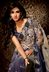 Embroidered sarees are the best choice for a girl to enhance her feminine look. This dusty grey and dark grey net saree is nicely designed with embroidered patch work is done with resham, zari and stone work. Beautiful embroidery work on saree make attractive to impress all. This saree gives you a modern and different look in fabulous style. Matching blouse is available. Slight color variations are possible due to differing screen and photograph resolution.