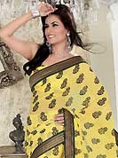 Era with extension in fashion, style, Grace and elegance have developed grand love affair with this ethnical wear. This yellow chiffon saree is nicely designed with embroidered patch work is done with resham and zari work. Beautiful embroidery work on saree make attractive to impress all. This saree gives you a modern and different look in fabulous style. Matching blouse is available. Slight color variations are possible due to differing screen and photograph resolution.