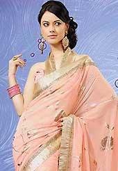 Let your personality articulate for you with this amazing embroidered saree. This peach faux georgette saree is nicely designed with foil print, zari, lace and graceful patch border work. Saree gives you a singular and dissimilar look. Matching blouse is available. Slight color variations are possible due to differing screen and photograph resolution.