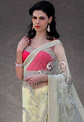 Different colors are a perfect blend of traditional Indian heritage and contemporary artwork. This cream net saree is nicely designed with embroidered patch work is done with stone, cutbeads and lace work. Beautiful embroidery work on saree make attractive to impress all. This saree gives you a modern and different look in fabulous style. Contrasting dark pink blouse is available. Slight color variations are possible due to differing screen and photograph resolution.