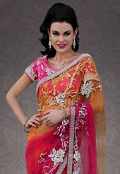 The most beautiful refinements for style and tradition. This orange and shaded dark pink net saree is nicely designed with embroidered patch work is done with resham and stone work. Beautiful embroidery work on saree make attractive to impress all. This saree gives you a modern and different look in fabulous style. Matching pink blouse is available. Slight color variations are possible due to differing screen and photograph resolution.