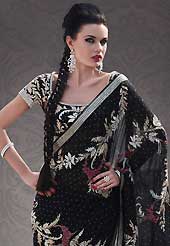 Outfit is a novel ways of getting yourself noticed. This black georgette saree is nicely designed with embroidered patch work is done with stone work. Beautiful embroidery work on saree make attractive to impress all. This saree gives you a modern and different look in fabulous style. Matching blouse is available. Slight color variations are possible due to differing screen and photograph resolution.