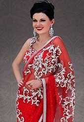 Ultimate collection of embroidered sarees with fabulous style. This red net saree is nicely designed with embroidered patch work is done with stone work. Beautiful embroidery work on saree make attractive to impress all. This saree gives you a modern and different look in fabulous style. Matching blouse is available. Slight color variations are possible due to differing screen and photograph resolution.
