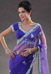 Try out this year top trend, glowing, bold and natural collection. This dark purple net saree is nicely designed with embroidered patch work is done with stone work. Beautiful embroidery work on saree make attractive to impress all. This saree gives you a modern and different look in fabulous style. Matching blouse is available. Slight color variations are possible due to differing screen and photograph resolution.